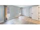 This bedroom features sleek wood-look floors, neutral walls, and plenty of natural light at 1937 Palm Dr, Clearwater, FL 33763