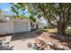 Lovely home with an attached garage, driveway, and lush shade tree enhancing curb appeal at 1937 Palm Dr, Clearwater, FL 33763