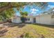 Delightful single-Gathering home featuring a cozy front yard and attached single-car garage at 1937 Palm Dr, Clearwater, FL 33763