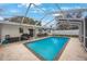Enjoy outdoor living with this crystal clear pool inside a screened enclosure offering a perfect space for recreation and entertaining at 1937 Palm Dr, Clearwater, FL 33763