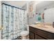 Nautical themed bathroom featuring anchor shower curtain, and modern vanity at 2259 Renton Ln, Spring Hill, FL 34609