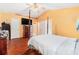 Bright bedroom features a four-poster bed, a ceiling fan, and multiple closets for ample storage at 2259 Renton Ln, Spring Hill, FL 34609