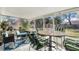 Enclosed sunroom with comfortable seating, a table, and views of the backyard at 2259 Renton Ln, Spring Hill, FL 34609