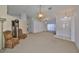 Bright living space featuring high ceilings, ceiling fan, and neutral color scheme at 2449 E Del Webb Blvd, Sun City Center, FL 33573