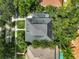 Birds eye view of home featuring a unique roof design and lush landscaping at 2603 W Parkland Blvd, Tampa, FL 33609