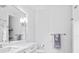 Bright bathroom featuring a large mirror, marble countertop, and soft towel at 2603 W Parkland Blvd, Tampa, FL 33609