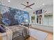 Bright bedroom featuring hardwood floors, natural light, and a detailed map wall at 2603 W Parkland Blvd, Tampa, FL 33609
