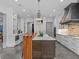 Gourmet kitchen features a large island, custom cabinetry, and modern appliances for culinary excellence at 2603 W Parkland Blvd, Tampa, FL 33609