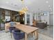 This living room and kitchen features a large island, stainless steel appliances, and bar seating at 2603 W Parkland Blvd, Tampa, FL 33609