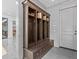 Inviting mud room with custom shelving and a bench, perfect for keeping your home organized at 2603 W Parkland Blvd, Tampa, FL 33609