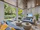 Screened-in patio with comfortable couches and views of backyard swimming pool at 2603 W Parkland Blvd, Tampa, FL 33609