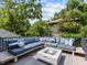 Outdoor rooftop deck with comfortable seating, throw pillows, and a modern fire pit at 2603 W Parkland Blvd, Tampa, FL 33609