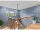 Staircase with beautiful woodworking details, a modern light fixture, and large window at 2603 W Parkland Blvd, Tampa, FL 33609