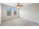 Bedroom filled with natural light features carpet and a ceiling fan at 2747 Via Capri # 1122, Clearwater, FL 33764