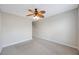 Bedroom with neutral walls, carpet, and a stylish ceiling fan at 2747 Via Capri # 1122, Clearwater, FL 33764