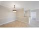 Dining area with tile floors, stylish lighting and a convenient pass-through to the kitchen at 2747 Via Capri # 1122, Clearwater, FL 33764