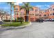 Beautiful Mediterranean style condo complex with attached garages, manicured landscaping and ample parking spaces at 2747 Via Capri # 1122, Clearwater, FL 33764