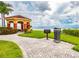 Scenic gazebo overlooking the water, complete with barbecue grill and lush landscaping at 2747 Via Capri # 1122, Clearwater, FL 33764