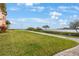 Scenic waterfront views from the well-manicured lawn and paved walkway at 2747 Via Capri # 1122, Clearwater, FL 33764
