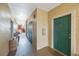 Hallway to condo unit, featuring neutral walls, clean flooring and access to units at 2747 Via Capri # 1122, Clearwater, FL 33764