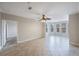 Open-concept living room boasting tile floors, recessed lighting and sunlit windows at 2747 Via Capri # 1122, Clearwater, FL 33764