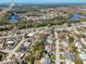 Aerial view of a residential community with mature trees, lakes and well-maintained properties at 3054 Bright Dr, Holiday, FL 34691