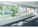 View of the backyard through the windows of the sunroom at 3054 Bright Dr, Holiday, FL 34691