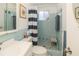 Cozy bathroom with blue tile, shower, and vanity offers a clean and functional space at 3054 Bright Dr, Holiday, FL 34691