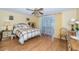 Cozy bedroom with hardwood floors, natural light, and a comfortable bed at 3054 Bright Dr, Holiday, FL 34691