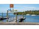 Anclote River boat dock and boat launch area with caution signs at 3054 Bright Dr, Holiday, FL 34691