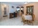 Inviting dining area with wooden table and chairs, plus charming display cabinet, ready for gatherings at 3054 Bright Dr, Holiday, FL 34691