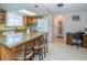Bright kitchen with island, granite countertops, and stainless steel appliances offers modern convenience at 3054 Bright Dr, Holiday, FL 34691