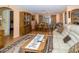 Open-concept living room with hardwood floors, a dining area, and comfortable seating at 3054 Bright Dr, Holiday, FL 34691