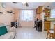 View of the living area with a window and adjacent kitchen space at 3054 Bright Dr, Holiday, FL 34691