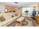 Inviting living room features a comfortable sofa, decorative rug, and ample space for relaxation and entertainment at 3054 Bright Dr, Holiday, FL 34691