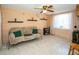 Cozy living area with a futon couch and decor at 3054 Bright Dr, Holiday, FL 34691