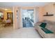 View of the dining and living area with sliding doors to the sunroom at 3054 Bright Dr, Holiday, FL 34691