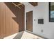 Inviting entryway featuring modern wood paneling, striking light fixture and contemporary front door with sleek hardware at 3721 6Th N Ave, St Petersburg, FL 33713