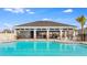 Inviting community pool with shaded seating areas and meticulously landscaped grounds at 3832 Turning Tides Ter, Bradenton, FL 34208