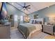 Serene main bedroom with a ceiling fan and natural light from windows at 4919 Chancellor Ne St, St Petersburg, FL 33703