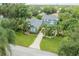 Beautiful aerial view of the property with lush landscaping and a long driveway at 5114 N Branch Ave, Tampa, FL 33603