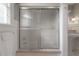 Bathroom shower with clear glass door at 5114 N Branch Ave, Tampa, FL 33603