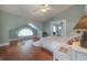 Spacious bedroom features high ceilings, hardwood floors, and a seating area by the window at 5114 N Branch Ave, Tampa, FL 33603