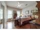 Bedroom featuring hardwood floors, natural light, and vintage furnishings at 5114 N Branch Ave, Tampa, FL 33603