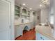 Charming butler's pantry featuring custom cabinetry, marble countertop, and stylish fixtures at 5114 N Branch Ave, Tampa, FL 33603