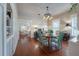 Bright dining room with a round table, hardwood floors, and decorative chandelier at 5114 N Branch Ave, Tampa, FL 33603