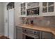 Granite countertops, stainless steel oven and microwave, and custom cabinets at 5114 N Branch Ave, Tampa, FL 33603