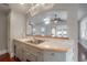 Charming kitchen sink with marble countertops and a view into the adjacent living area at 5114 N Branch Ave, Tampa, FL 33603