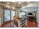 Open kitchen with stainless steel stove island, and sliding doors at 5114 N Branch Ave, Tampa, FL 33603