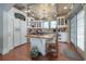 Spacious kitchen featuring a wooden center island, stainless steel appliances, and custom cabinets at 5114 N Branch Ave, Tampa, FL 33603